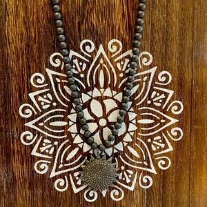 Diamond charm on beads